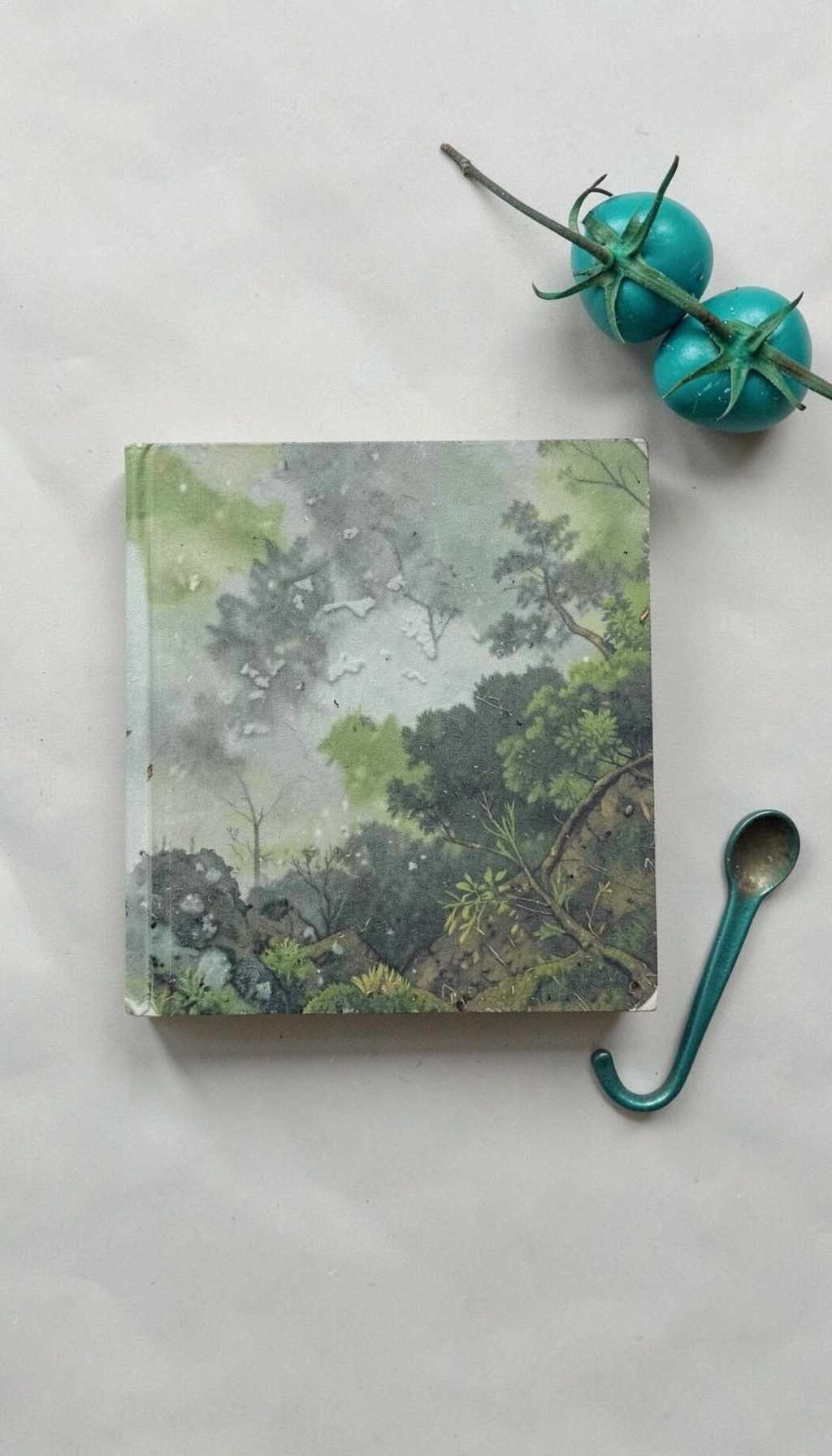 A book cover with earthy green and grey tones, suggesting ecological themes and biblical reflection